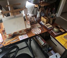 a table with art supplies on top of it