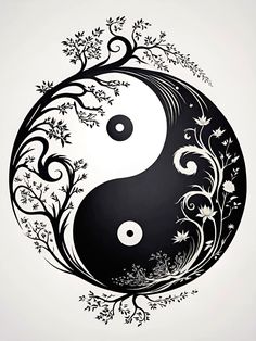 a black and white yin yang symbol with flowers