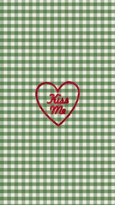 a green and white checkered background with a red heart that says miss you on it