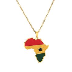 a gold necklace with the shape of africa and a red, yellow and green star on it