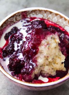 a close up of a bowl of food with berries