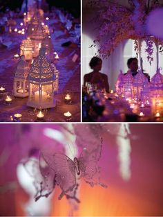 purple and white wedding decor with candles, butterfly lantern and fairy figurines on the table