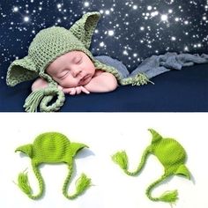 the baby is wearing a green knitted hat and sleeping on it's side