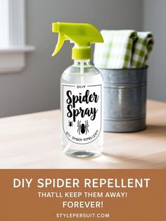 a spider spray bottle sitting on top of a wooden table