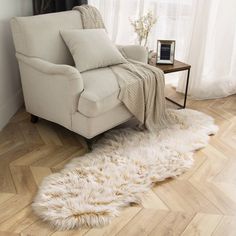 a white chair sitting on top of a hard wood floor