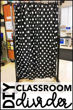 a classroom divider with black and white polka dots