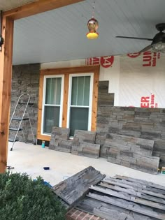 the front porch is being remodeled and ready to be used as an outdoor living space