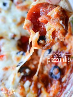 a close up of a slice of pizza on a fork with the word easy pizza dip above it