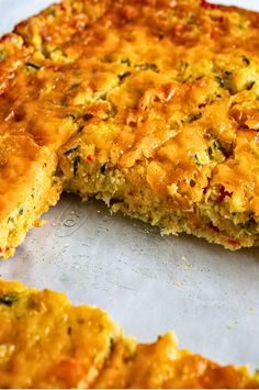 a close up of food on a pan with one piece missing from it's crust