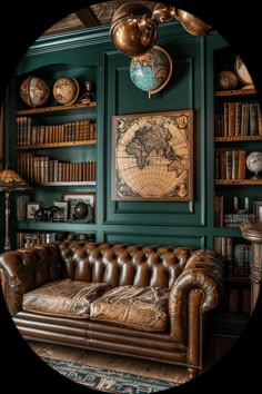 a living room with green walls and leather couches in front of bookshelves