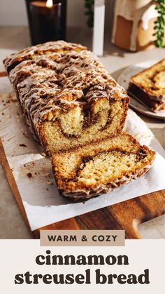 a loaf of cinnamon bread sitting on top of a cutting board