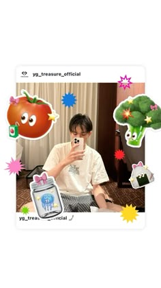 a man taking a selfie with his cell phone in front of an assortment of stickers