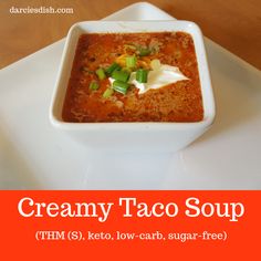 a bowl of creamy taco soup with sour cream on top