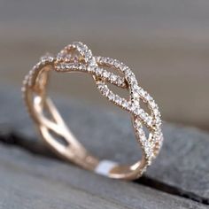 a diamond ring on top of a wooden table