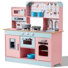 a pink and blue play kitchen with lots of accessories