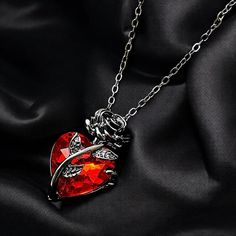 ✨ Rose and Heart Gothic Necklace - Red Ruby Gem Victorian Jewelry - Dark Romantic Handmade Statement Necklace, Unique Gift for Her ✨ 🌹 Searching for the perfect blend of romance and gothic elegance? This stunning necklace is more than just jewelry--it's a statement! ❤️ A unique necklace featuring a dark rose heart design with a deep red ruby gem, capturing the essence of Victorian romance and mysterious beauty. Perfect for a special night out or to complete an everyday look with presence. 🎁 Handmade with attention to detail, this one-of-a-kind necklace is for the woman who celebrates her uncompromising style. Not just a gift--it's an unforgettable treasure. 📦 The necklace comes beautifully packaged, ready for gifting. Order now and make her feel special! 🌹 Ruby Heart Necklace, Handmade Statement Necklace, Victorian Romance, Dark Romantic, Rosé Heart, Gothic Necklace, Red Necklace, Unique Gifts For Her, Victorian Jewelry