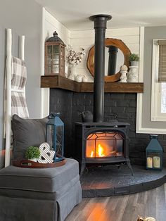 Painted my firplace dark, added floating shelf, and added shiplap. Corner Wood Stove, Wood Stove Hearth, Fireplace Design, Decor Living Room, Wood Burning Stove, Boho Bedroom