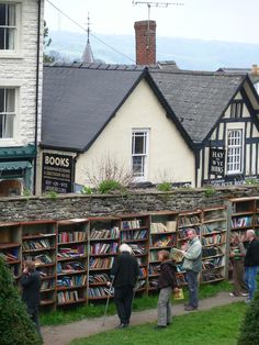 people are browsing through the books on display at an outdoor book store in england