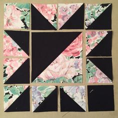 the blocks have been cut into squares with black and pink flowers on them to make a quilt