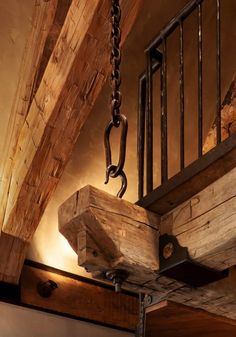 an old wooden beam is suspended from the ceiling