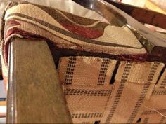 a knife and fork sitting on top of a piece of cloth next to a wooden table