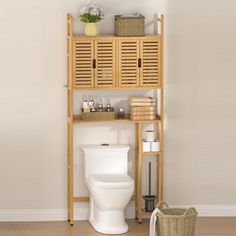 a bathroom with a toilet, shelf and basket on the floor in front of it