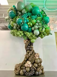 a tree made out of grapes and balloons