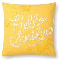 a yellow pillow with the words hello sunshine written in cursive writing on it