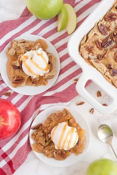 three plates with desserts on them sitting next to apples