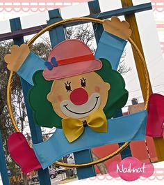 a close up of a sign with a clown on it's face and hands