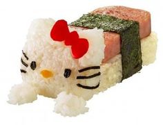 a hello kitty sushi is sitting on top of rice