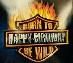 a sign that says born to happy - birthday be wild with flames in the background