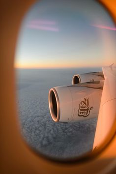 an airplane wing is seen through the window