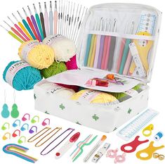 the knitting kit is packed with yarn, needles and crochet hooks to be used