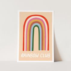 a rainbow card with the words rainbow club on it in white lettering, against a beige background