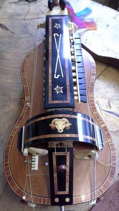 a musical instrument sitting on top of a wooden table