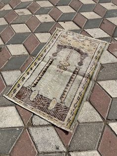 an old rug is laying on the ground