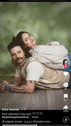 a man and woman laying on top of each other in front of a green background