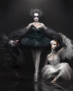 two women dressed in black and white with feathers