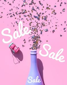 a pink bottle with confetti falling out of it and the words sale written in white