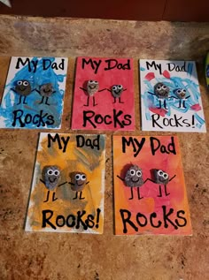 four handmade cards with the words my dad rocks written on them