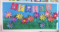 a bulletin board decorated with flowers and the words spring