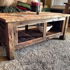 a living room with a coffee table made out of wood