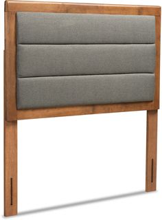 the headboard is made out of wood and has grey upholstered fabric on it