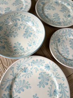 blue and white plates on a wooden table