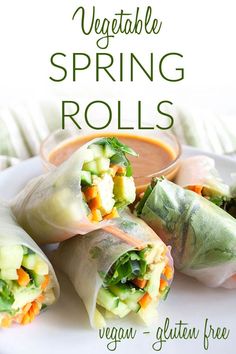 vegetable spring rolls on a white plate with dipping sauce in the background and text overlay that reads, vegetable spring rolls vegan - gluten free