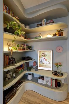 a room with shelves filled with books and plants on top of each shelf is lit by lights