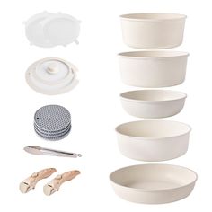 several white bowls and accessories are shown on a white background