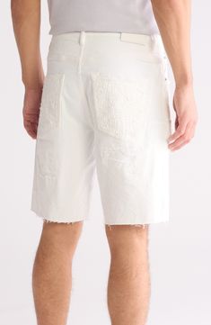 Heavy distressing is masked by a tonal wash on these denim shorts that are cut with a hint of stretch for lasting comfort on days off. 10" inseam; 11 1/2" leg opening; 12 3/4" front rise 98% cotton, 2% Lycra® spandex Machine wash, dry flat Imported Asian & Pacific Islander Owned/Founded Distressed White Cotton Bottoms, Ripped Cotton Shorts, Cotton Five-pocket Shorts For Summer, Cotton Summer Shorts With Five Pockets, Distressed Cotton Cutoff Shorts, Ripped Cotton Cutoff Shorts, White Cotton Jean Shorts With Frayed Hem, Summer Cotton Jean Shorts With Pockets, Distressed Cotton Short Jeans