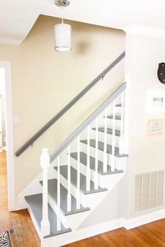 the stairs in this house are painted white